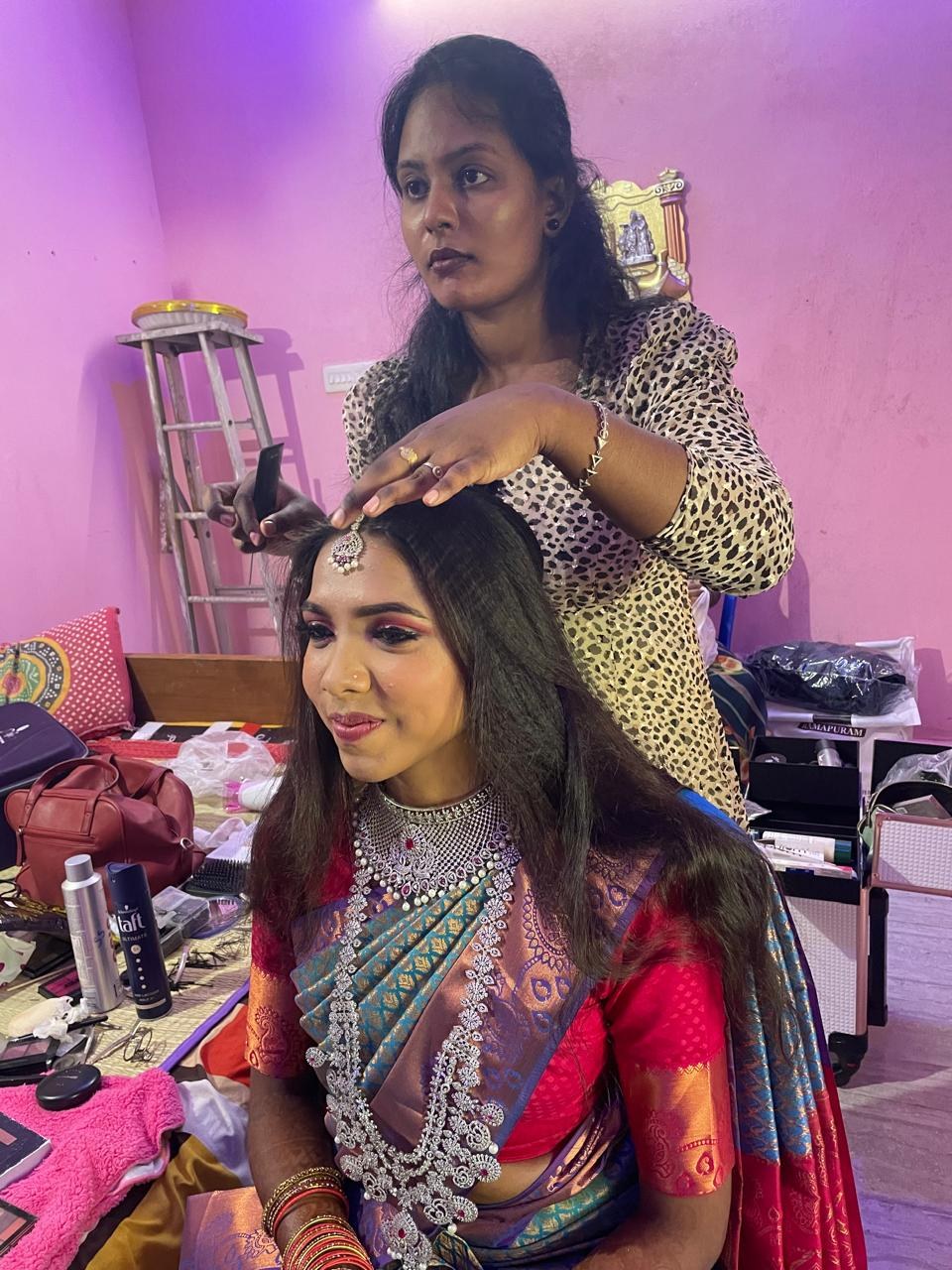 Kalaipriya R K at work on bridal hairstyling