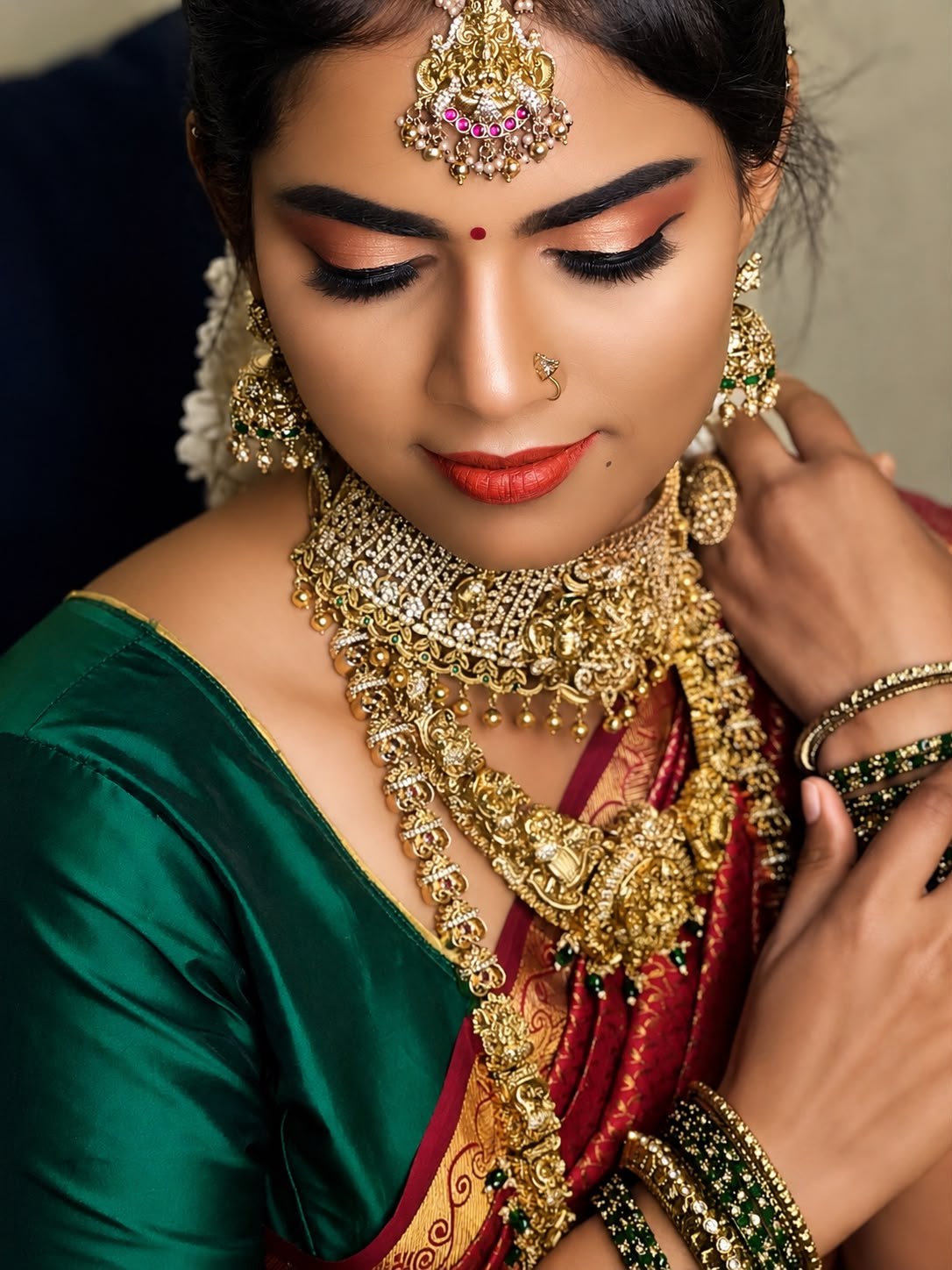 Bridal makeup close-up in an emerald green saree with statement jewellery