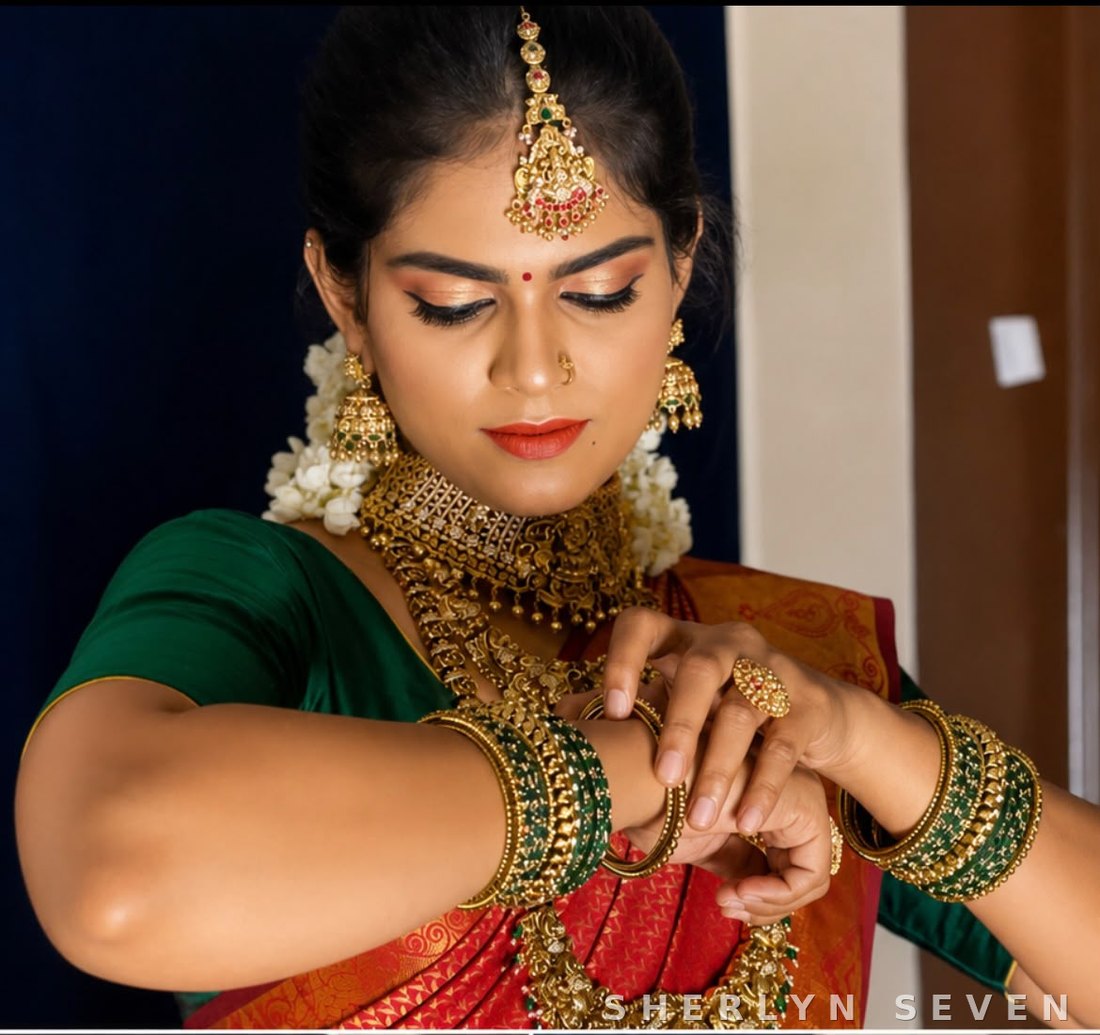 Bridal makeup and jewellery close-up in a green saree