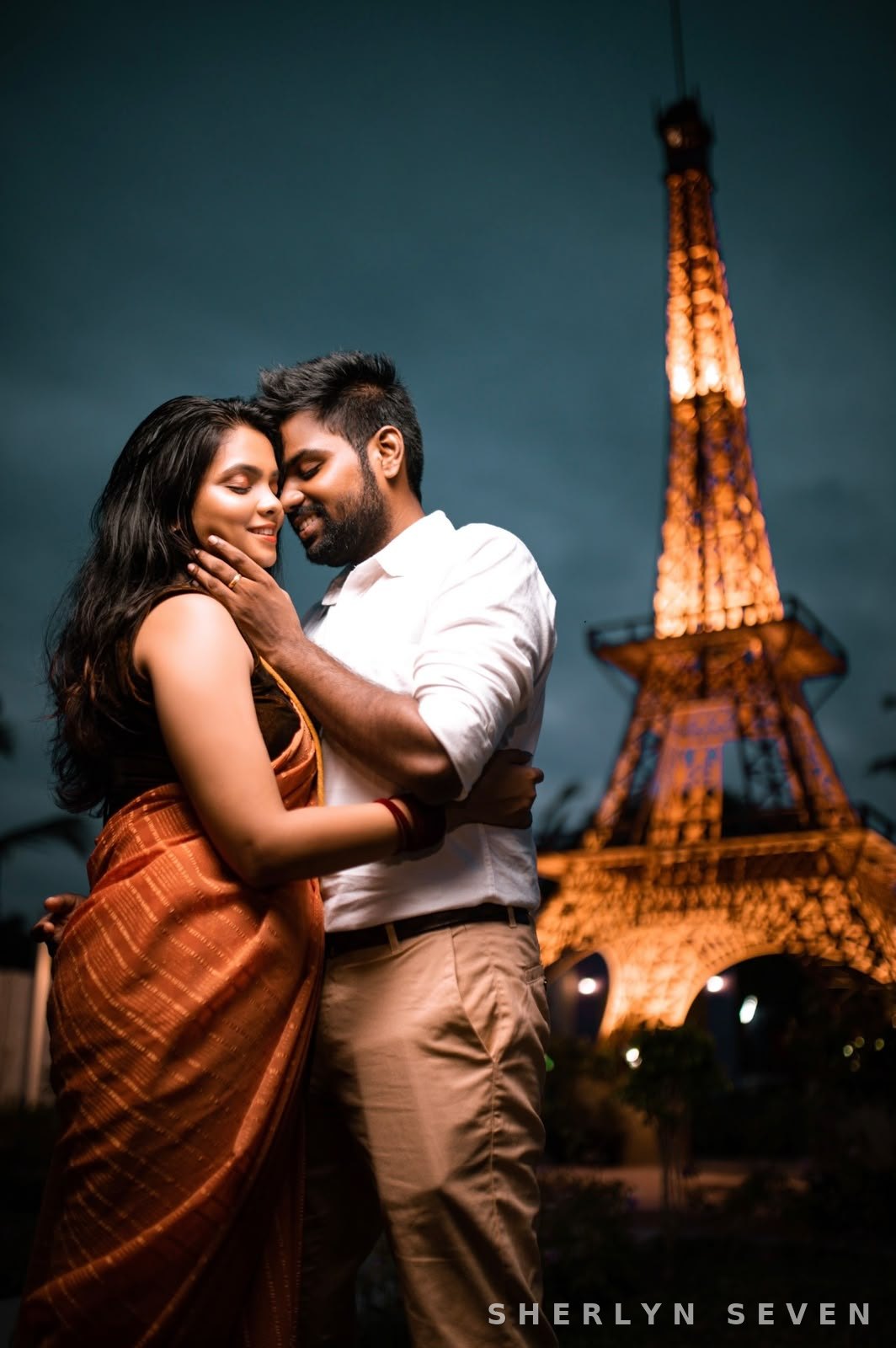 Engagement portrait of a couple in festive attire